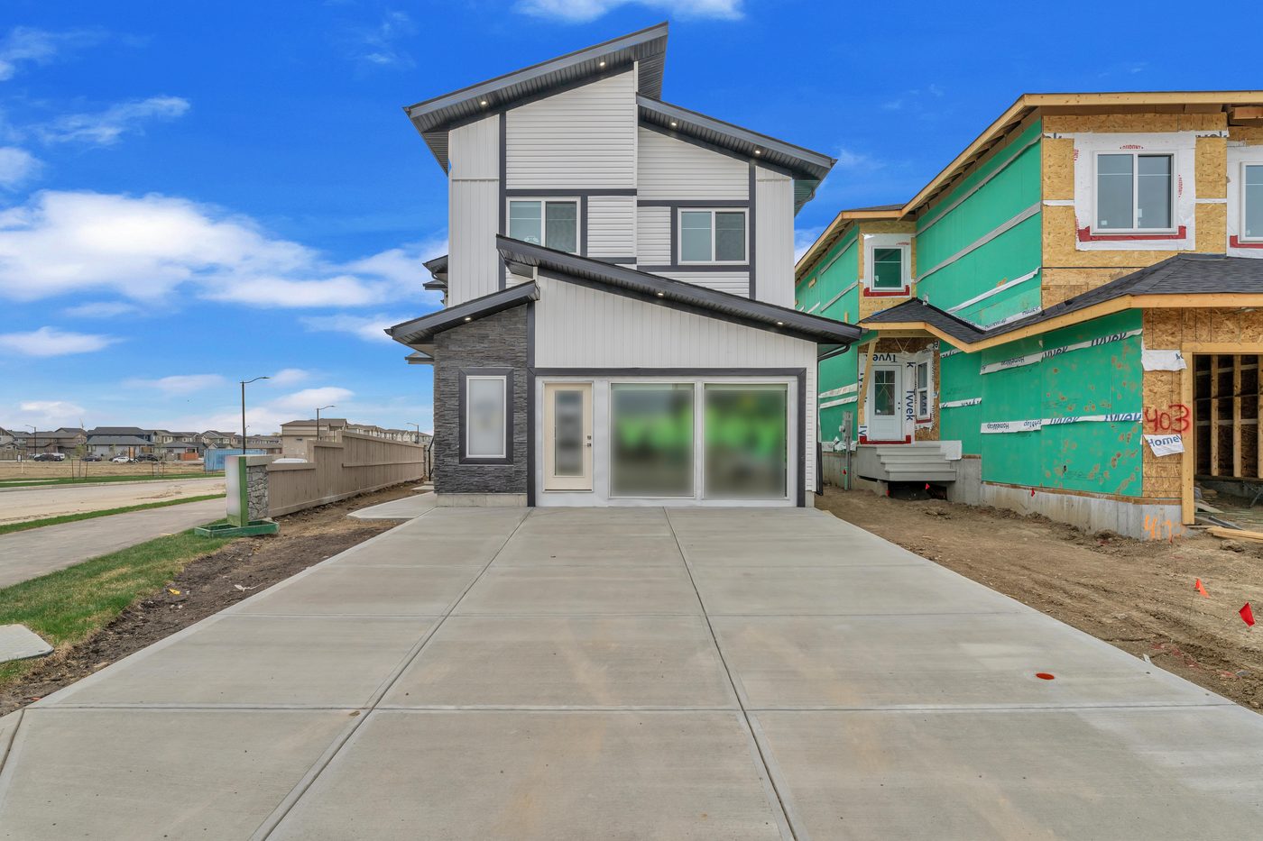 Modern duplex exterior, dusk, Beaumont